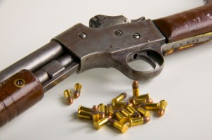 image of a rifle and bullet cartridges at gun auction site