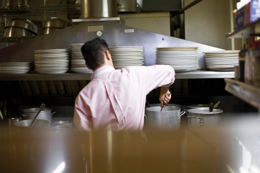 Restaurateur working in kitchen