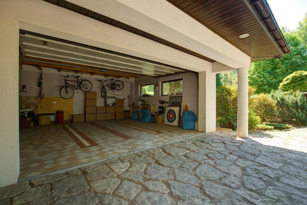 open garage with items stacked against the walls