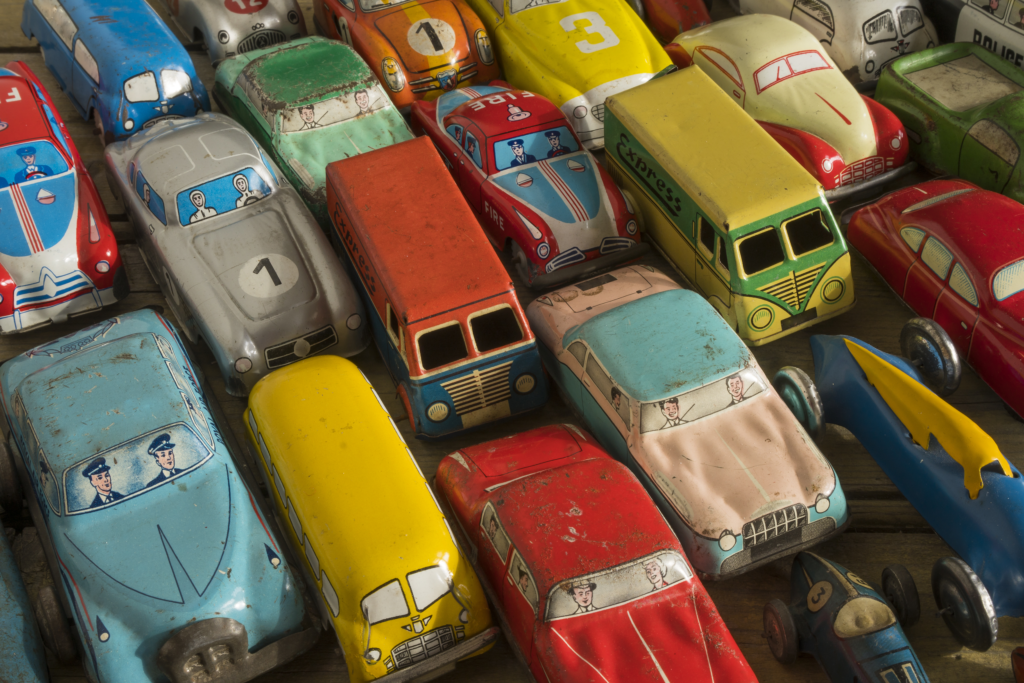 various antique colorful cars lined up bumper to bumper